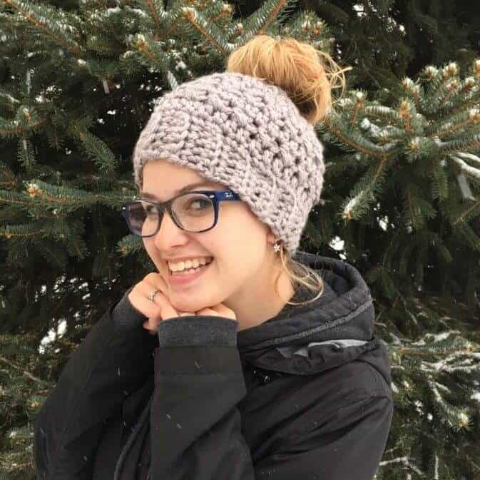 Photo of a woman wearing eyeglasses and a messy bun hat from Made with a Twist