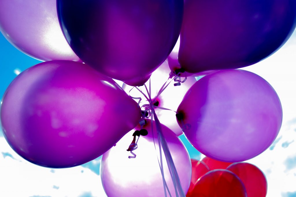 Photo of various colored balloon tied together