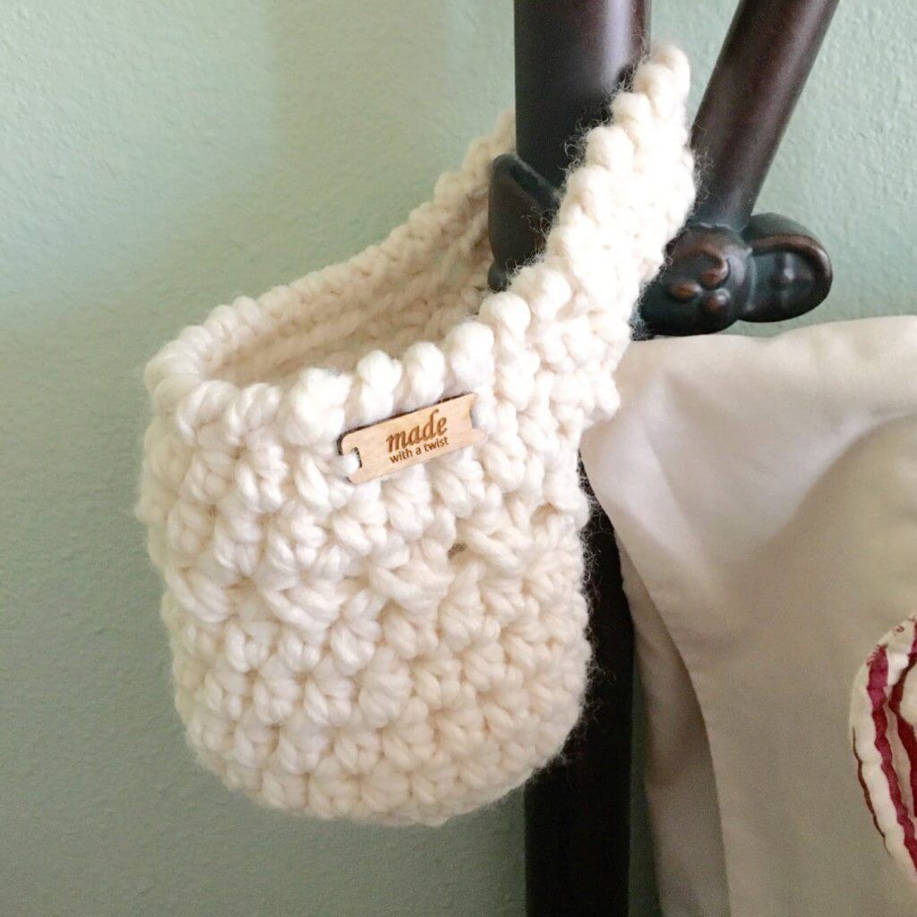 Photo of the FREE Crochet Pattern Hanging Basket on a bedside pole