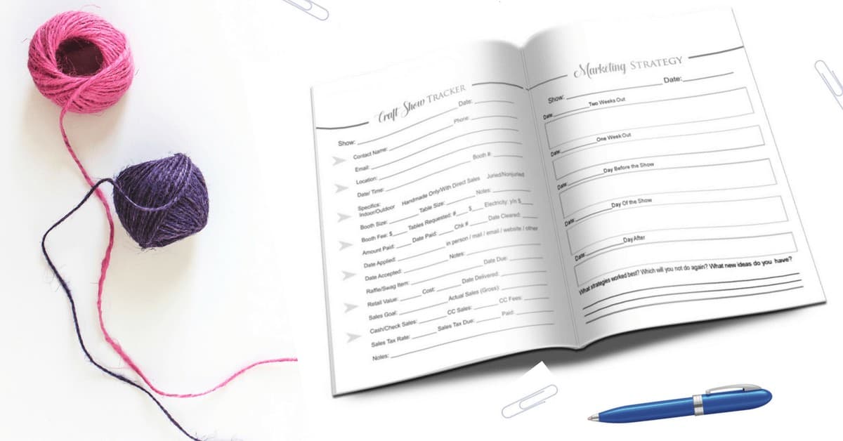 Photo of the Rock Your Craft Fair Planner with a pen and pink and purple yarn