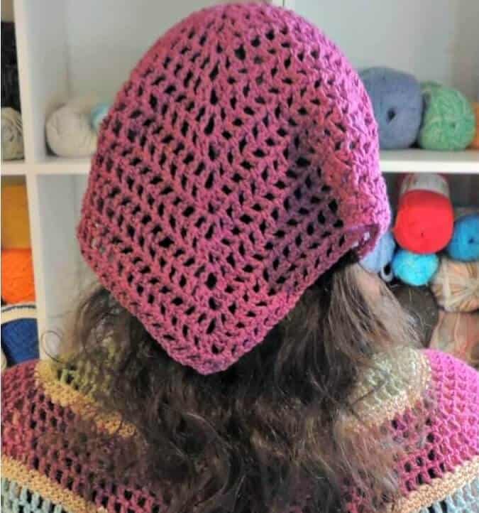 A woman wearing the crocheted Spring Kerchief 