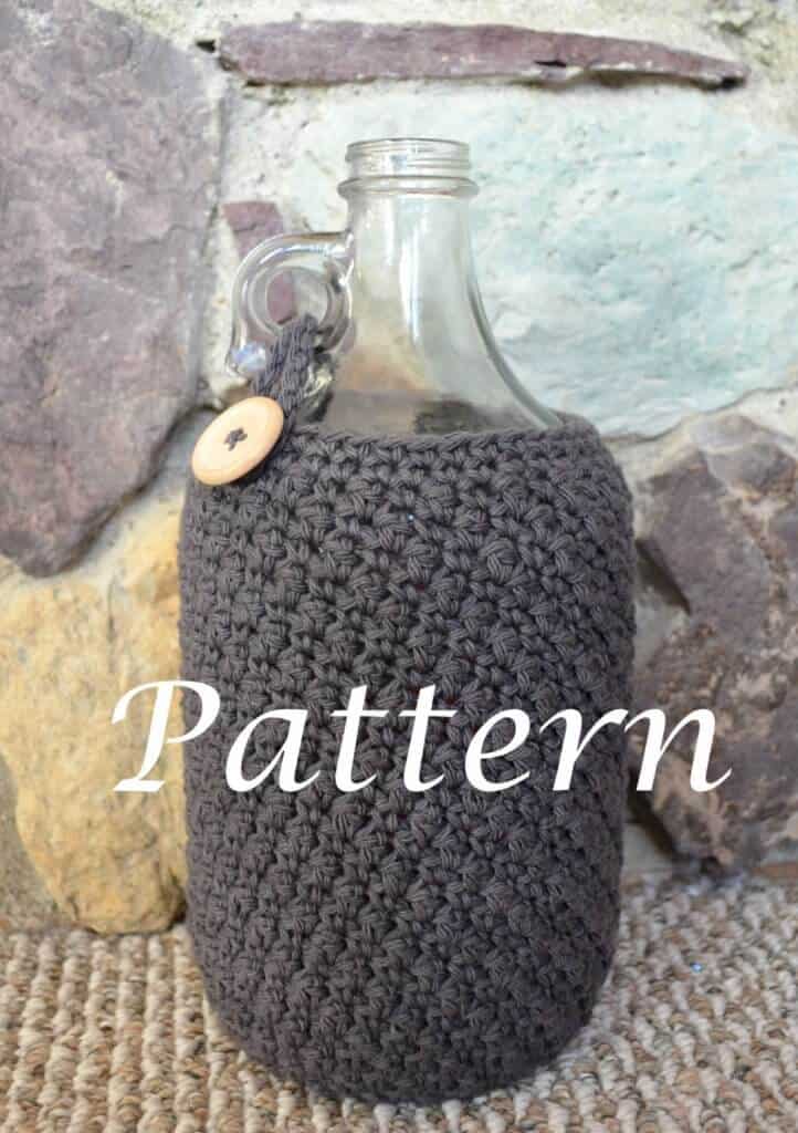 Photo of a crocheted beer growler cozy in a bottle with the word "Pattern" 