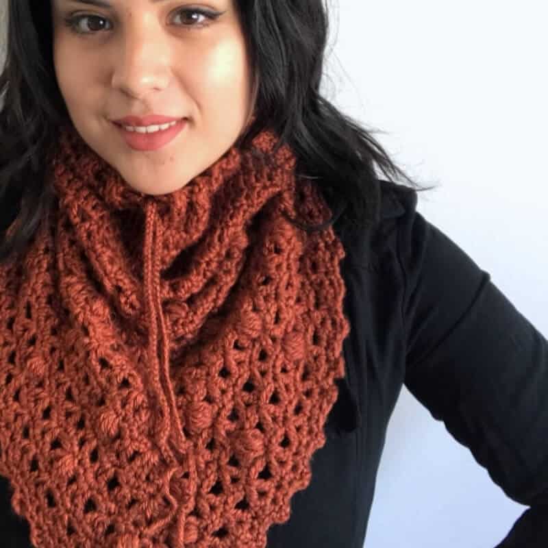 Photo of a woman wearing the Serenity Snood Triangle Cowl on her neck