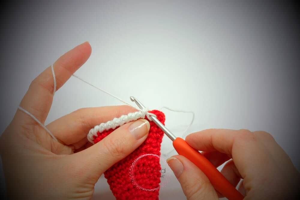 Instructional image while making the Santa har of Einar Christmas Elk FREE Amigurumi Crochet Pattern