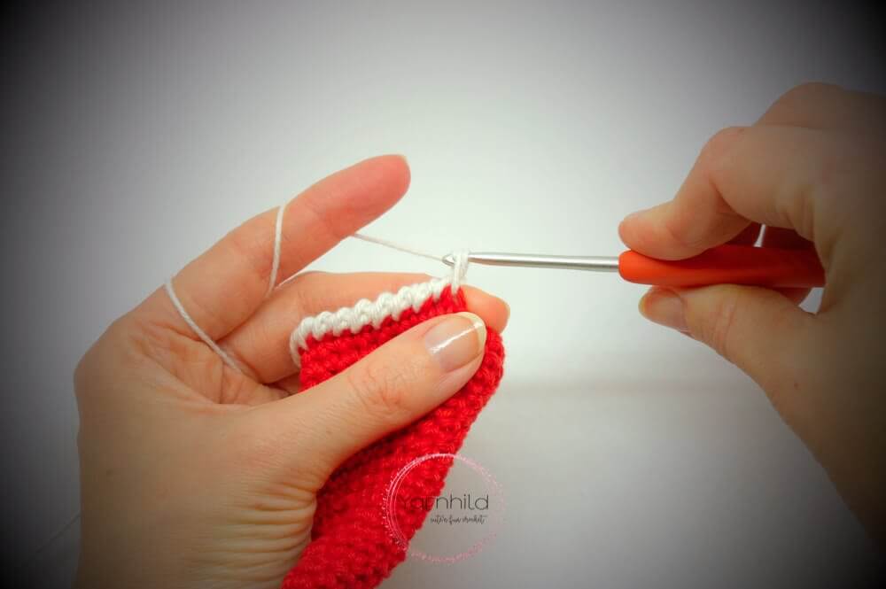Instructional image while making the Santa har of Einar Christmas Elk FREE Amigurumi Crochet Pattern