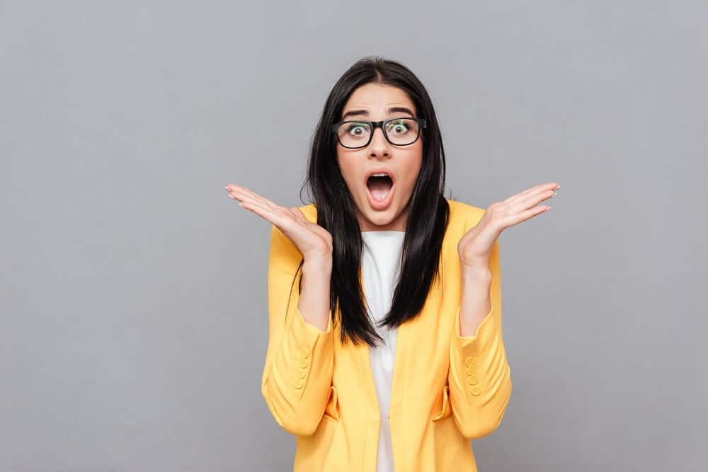 Image of a woman wearing glasses with a shocked expression