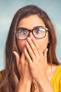 unexpected challenges handmade business - Woman with a shocked expression, with hands over her mouth