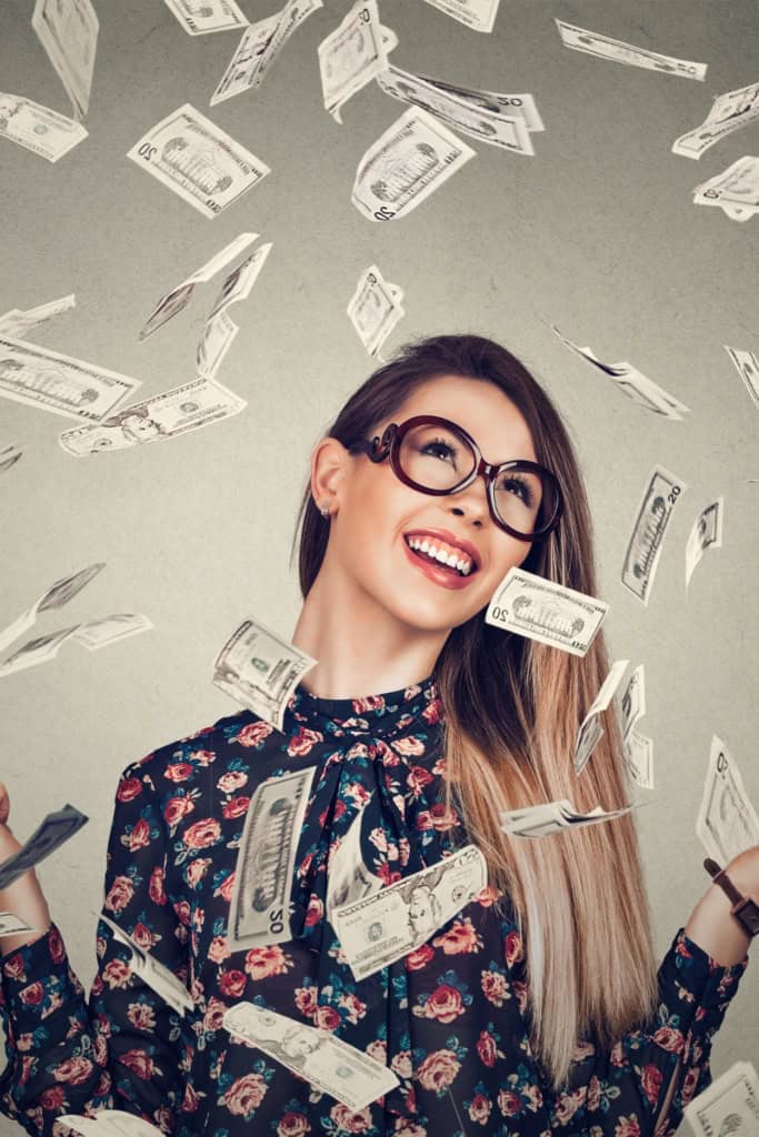 Successful Crochet Business - image of a woman with dollar bills falling around here