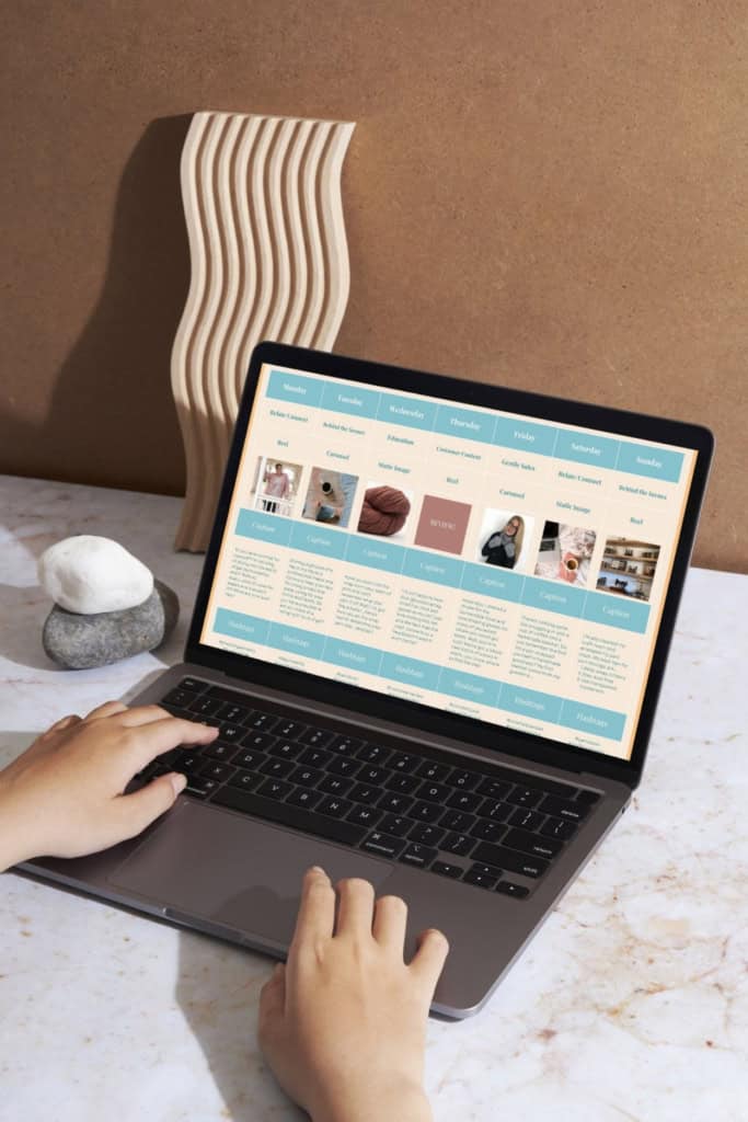 content calendar strategy - woman's hands on a laptop keyboard. on the screen is the social media content calendar template