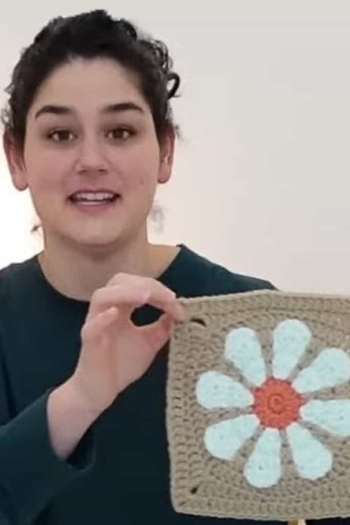 Elyse Myers showing a crochet flower square that was the center of an intellectual property controversy