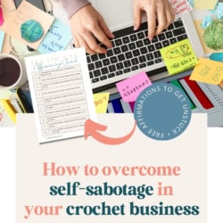 How to Stop Self-Sabotaging Your Crochet Business - Pin image featuring a cluttered desk with a laptop, sticky notes, balls of yarn and crochet hooks