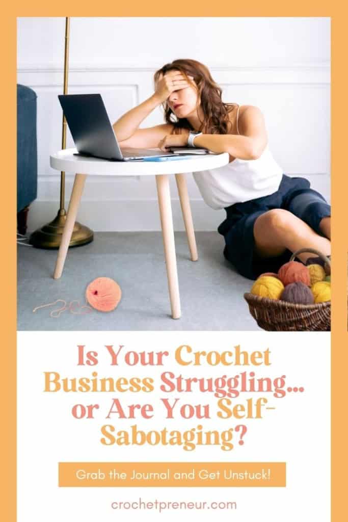 Self Sabotage in Crochet Business - image of a woman sitting in front of a laptop, looking overwhelmed. She's surrounded by balls of yarn.