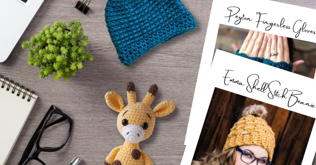 Desktop showing an assortment of crochet items and patterns, plus office supplies