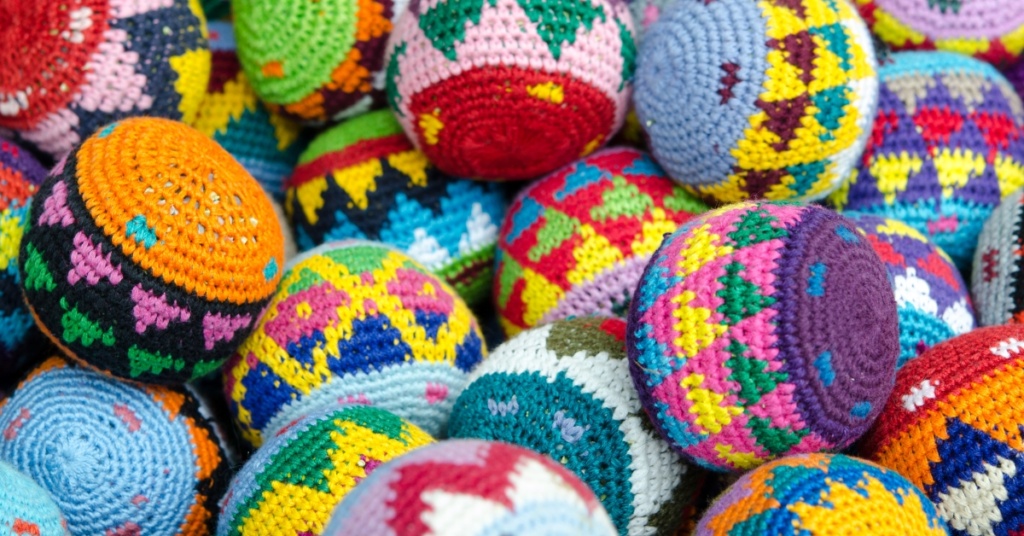 An assortment of brightly colored crochet footbags - should you sell them?