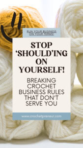 A stack of yarn, all white skeins except one yellow skein, which has a smiling face - text overlay reads: Stop 'Should'ing on Yourself: Breaking Crochet Business Rules that Don't Serve You